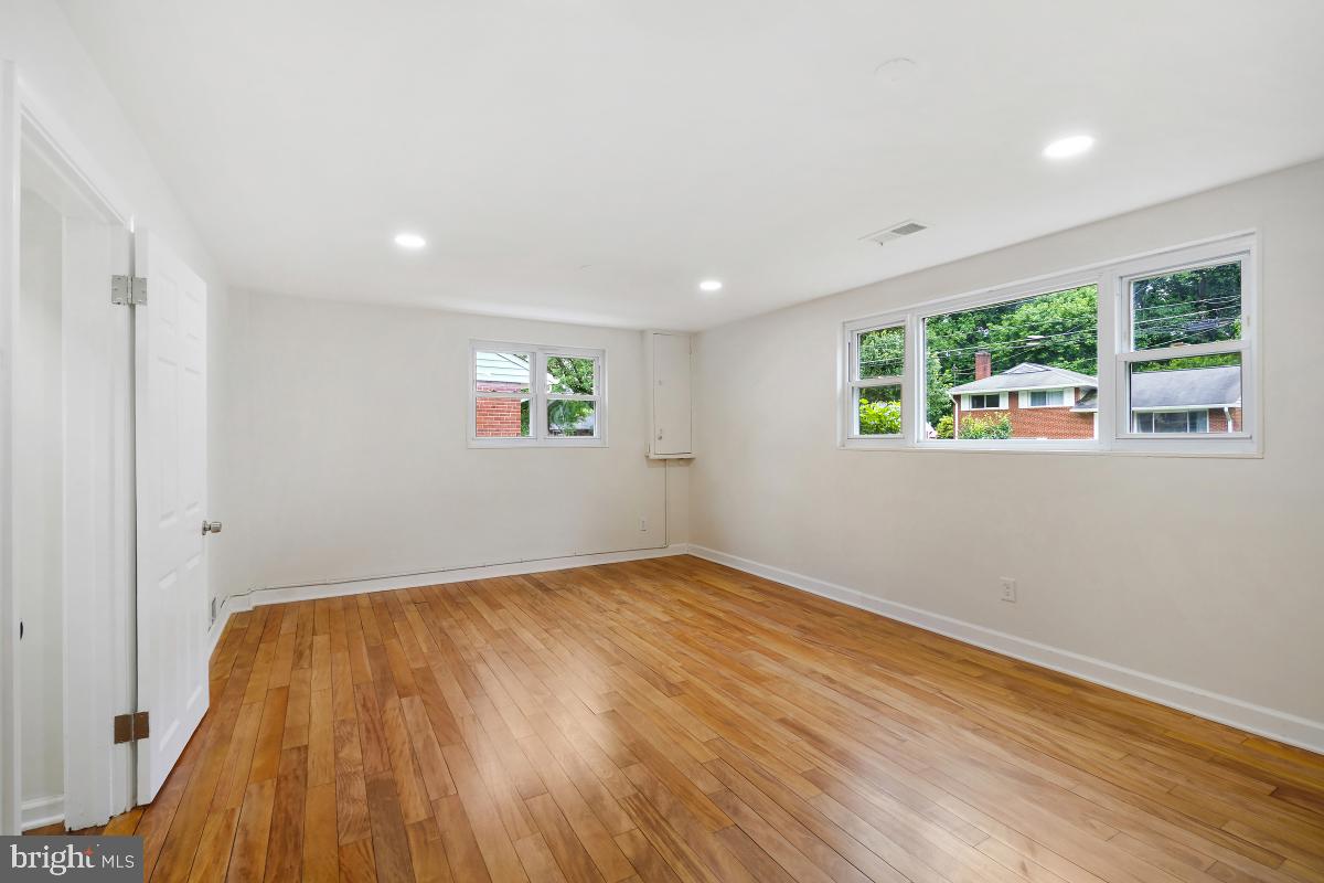 10307 Leslie Street Silver Spring, MD 20902 - Photo 32 of 46 wooden floor in an empty room with a window