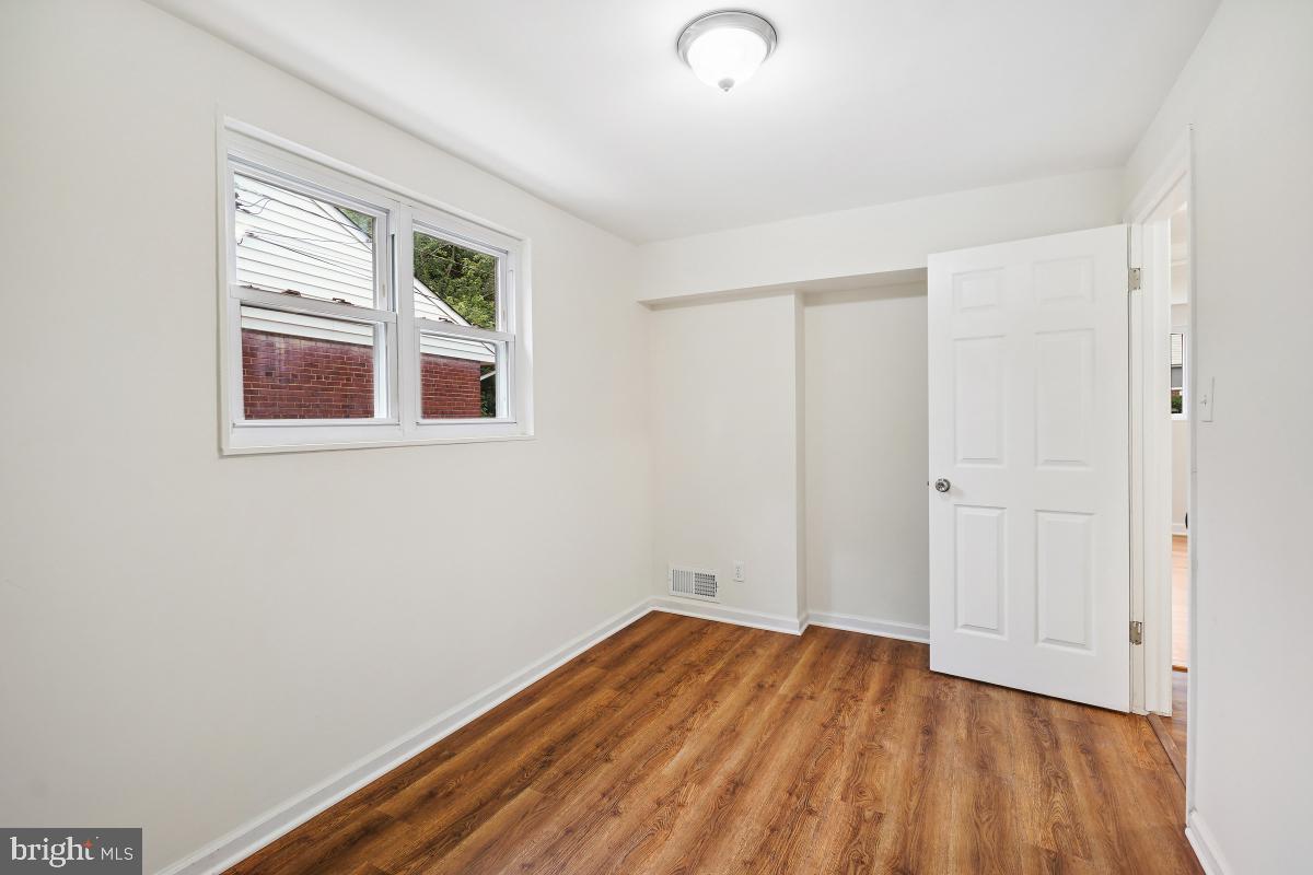10307 Leslie Street Silver Spring, MD 20902 - Photo 34 of 46 an empty room with a window