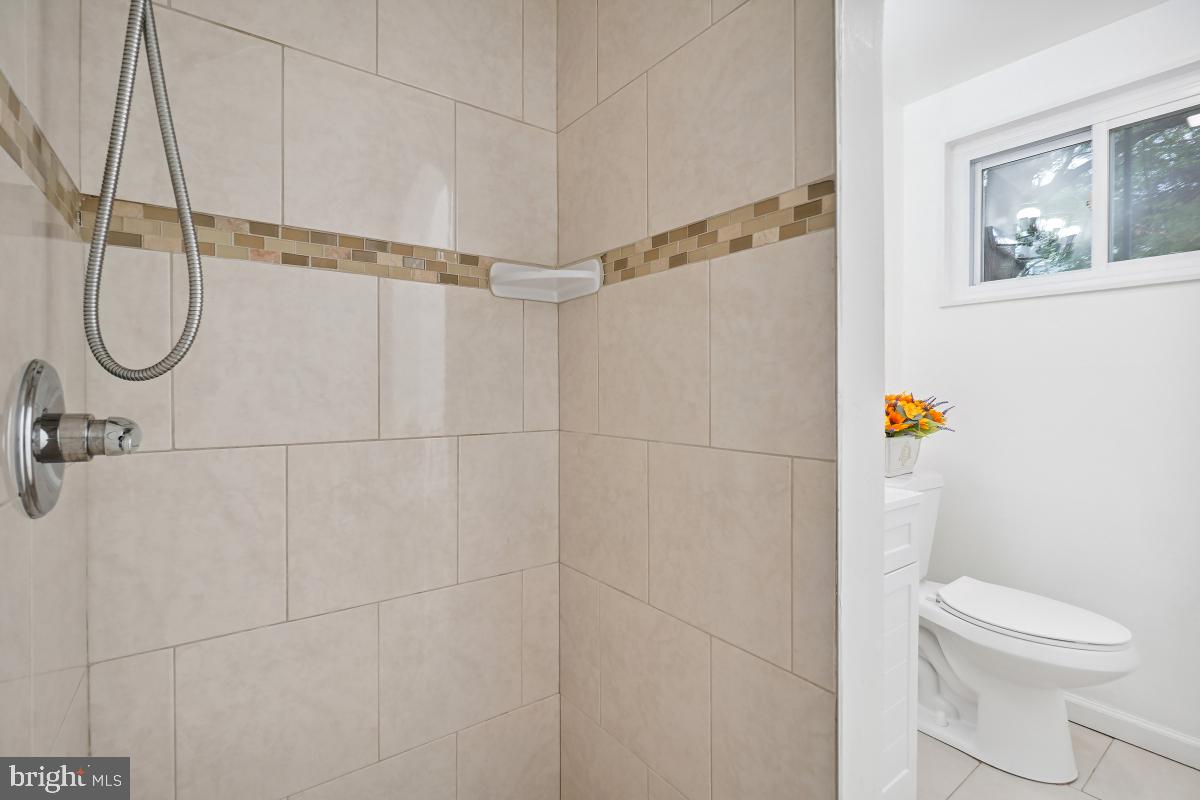 10307 Leslie Street Silver Spring, MD 20902 - Photo 35 of 46 a bathroom with a toilet and a shower