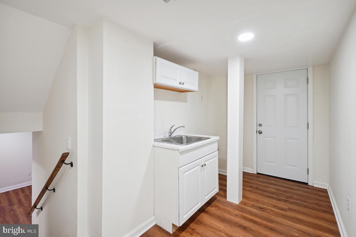 10307 Leslie Street Silver Spring, MD 20902 - Photo 37 of 46 a view of hallway with wooden floor
