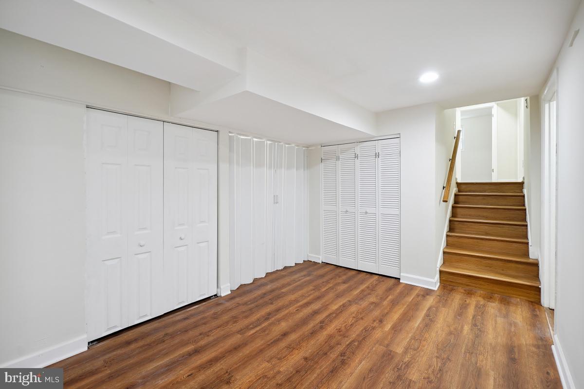 10307 Leslie Street Silver Spring, MD 20902 - Photo 39 of 46 a view of a room with wooden floor and white walls