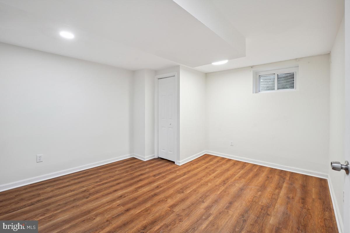 10307 Leslie Street Silver Spring, MD 20902 - Photo 40 of 46 a view of empty room with wooden floor