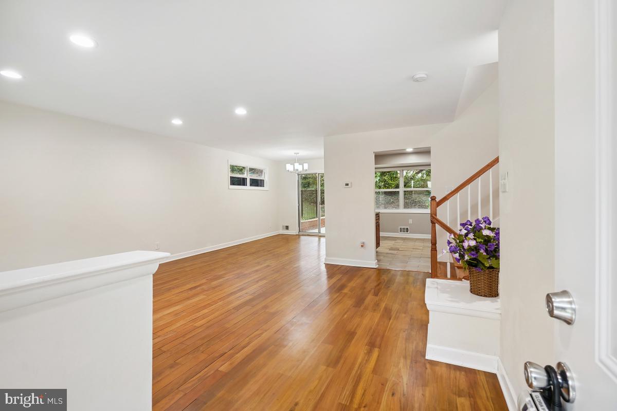 10307 Leslie Street Silver Spring, MD 20902 - Photo 4 of 46 a view of an empty room with wooden floor