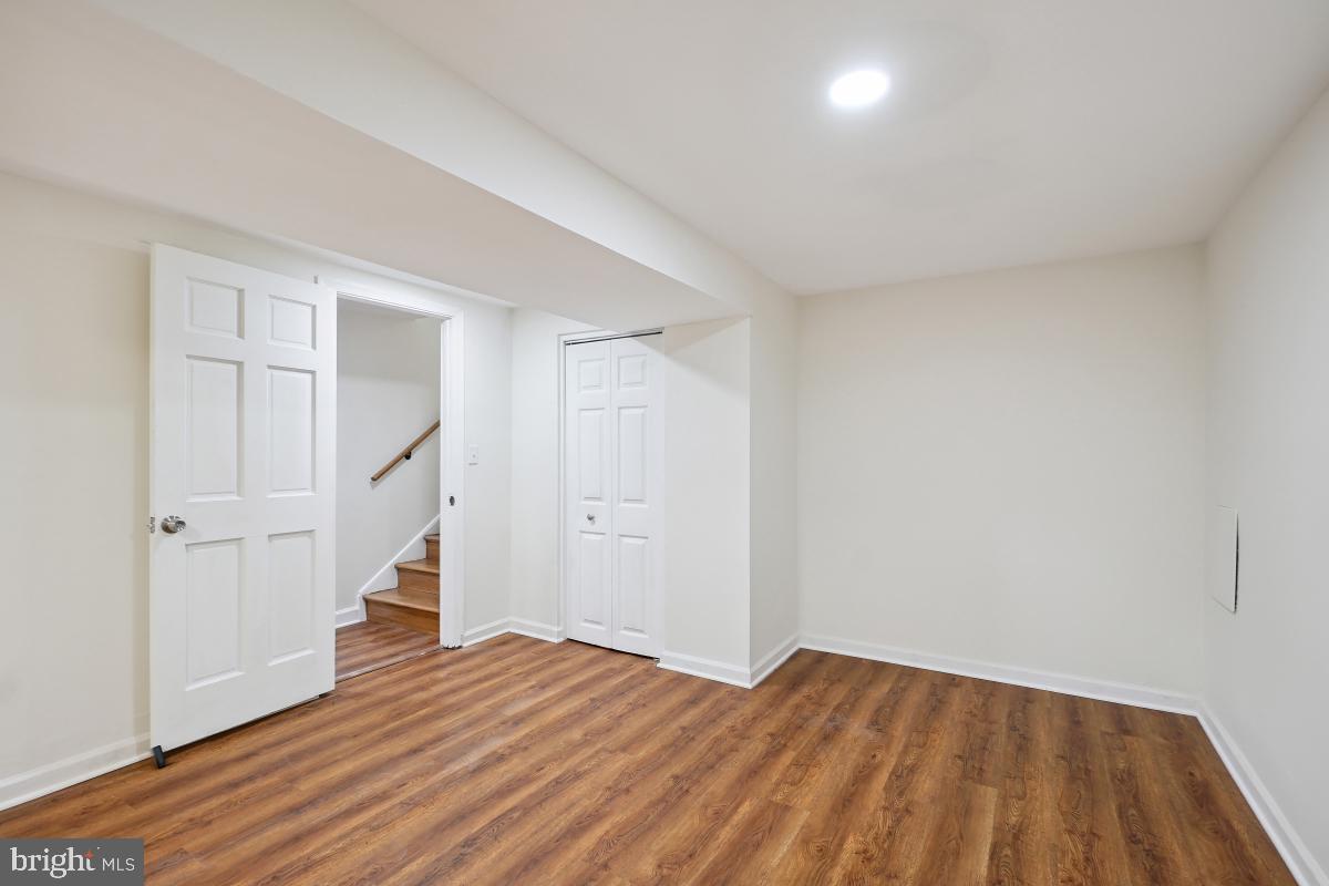 10307 Leslie Street Silver Spring, MD 20902 - Photo 41 of 46 a view of empty room with wooden floor