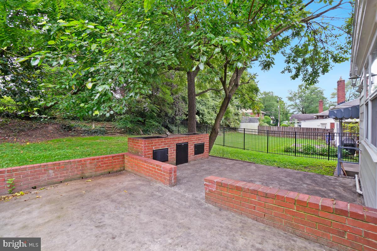 10307 Leslie Street Silver Spring, MD 20902 - Photo 45 of 46 a house with green field in front of it