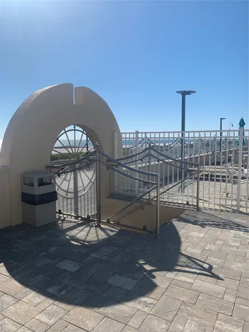 a view of a balcony with a potted plant