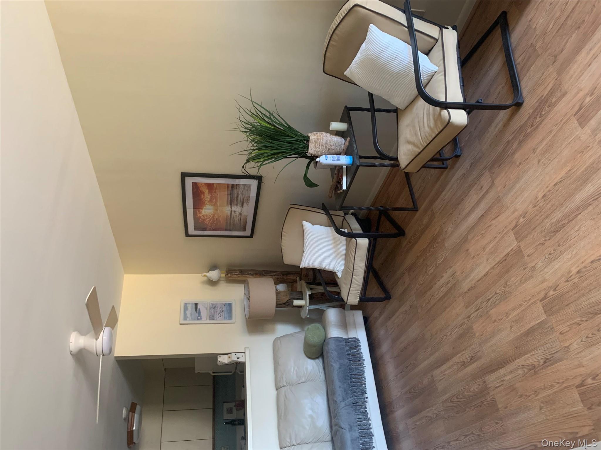 360 Shore Road, Unit 2H Long Beach, NY 11561 - Photo 4 of 13 Sitting room with ceiling fan
