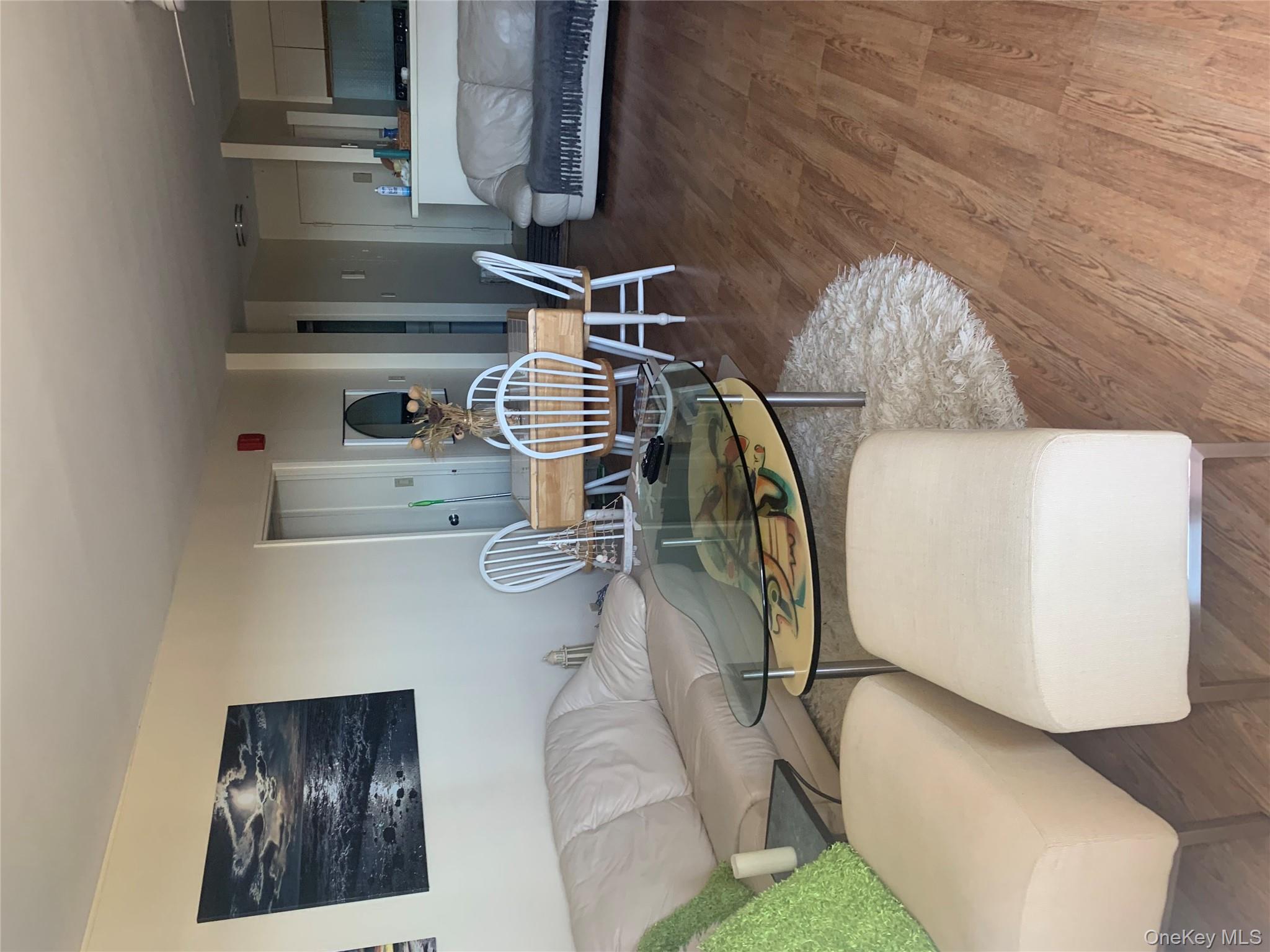 360 Shore Road, Unit 2H Long Beach, NY 11561 - Photo 5 of 13 Living area featuring wood finished floors