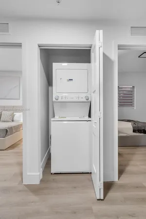 a utility room with washer and dryer