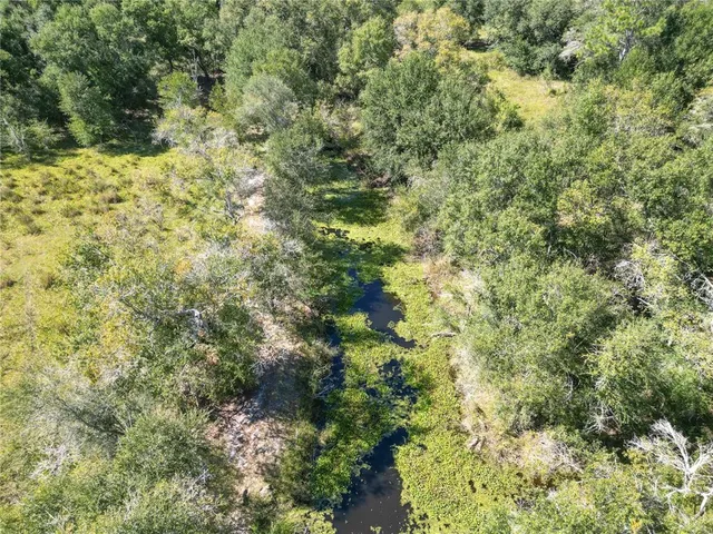 a view of a swimming pool with an outdoor space and seating area