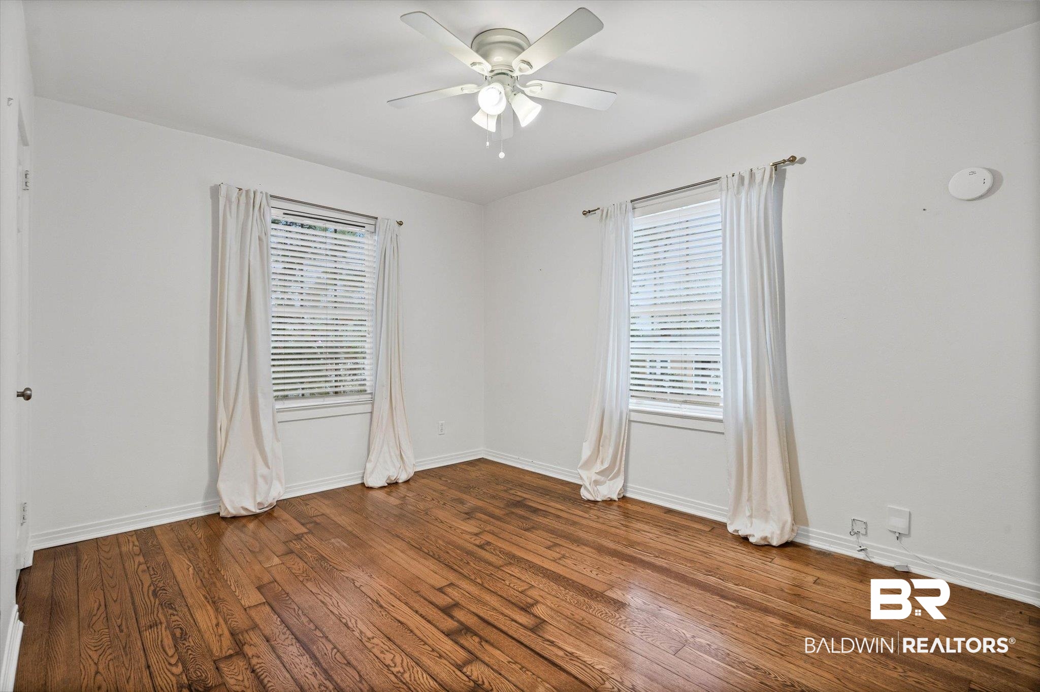 11 York Place Mobile, AL 36608 - Photo 14 of 24 Spare room with hardwood / wood-style floors and ceiling fan
