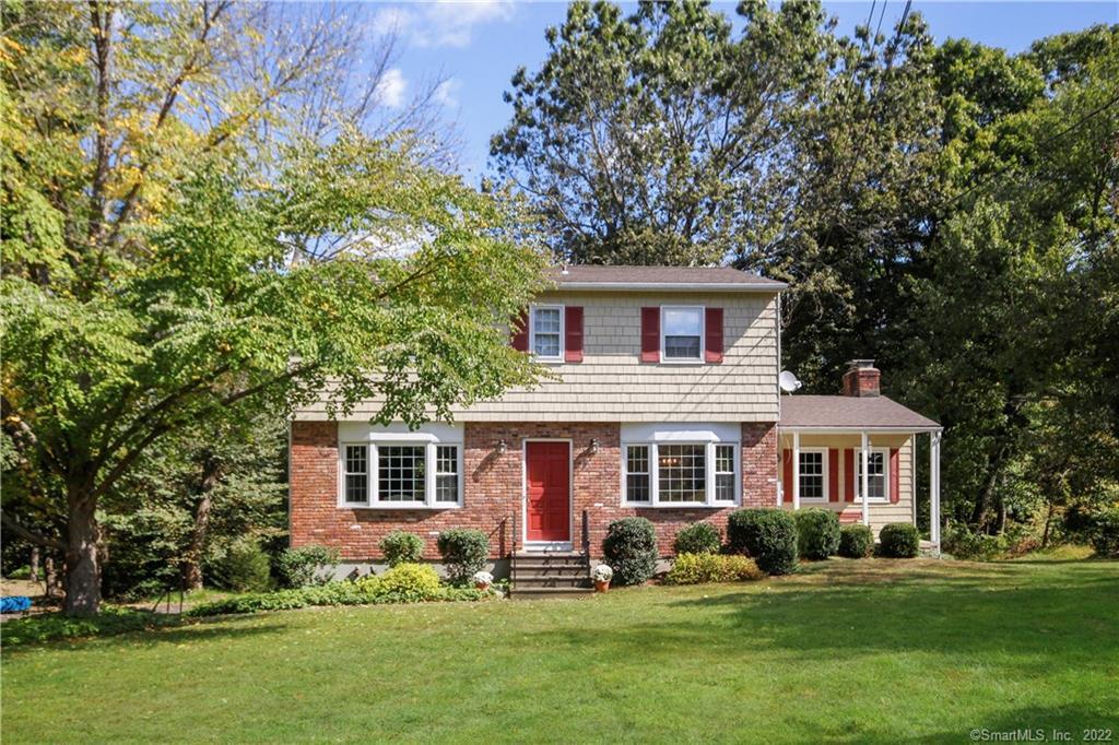 72 Hobby Drive Ridgefield, CT 06877 - Photo 1 of 1 front view of a house with a yard
