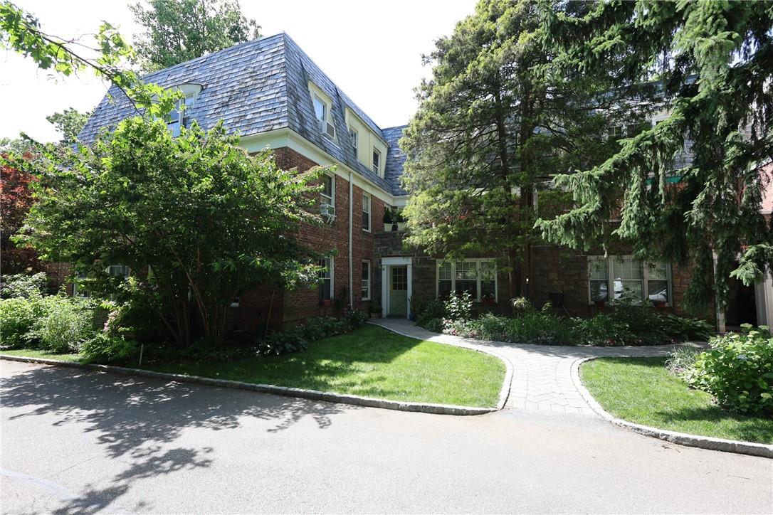 View of front of property with a front yard