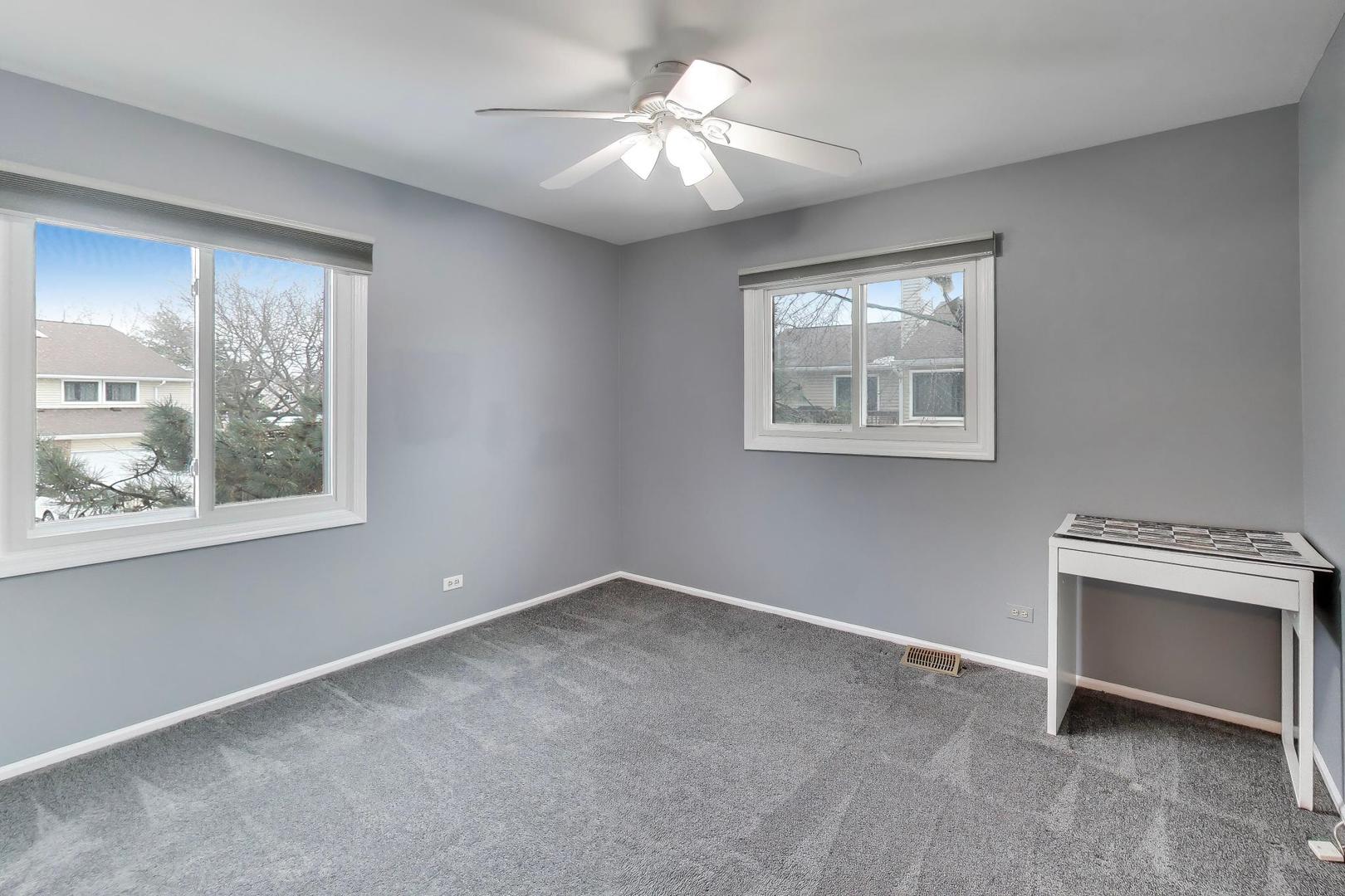 1096 Pine Tree Circle North Buffalo Grove, IL 60089 - Photo 19 of 25 a view of an empty room with a window