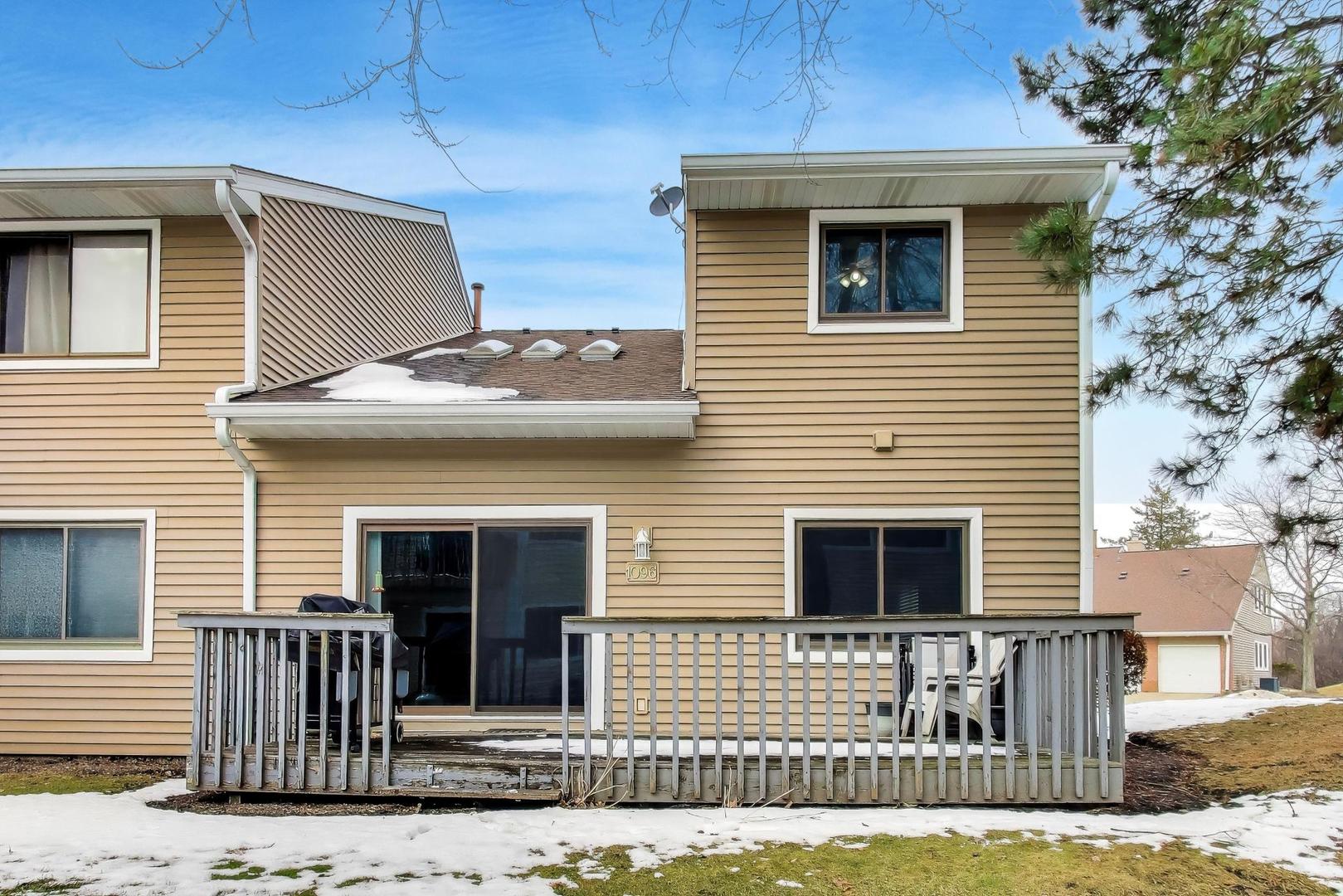 1096 Pine Tree Circle North Buffalo Grove, IL 60089 - Photo 24 of 25 a front view of a house with a yard