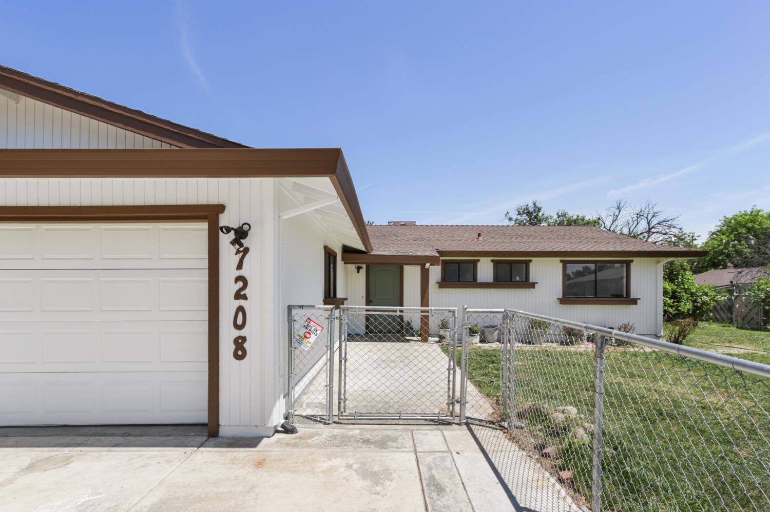 7208 7th Street Rio Linda, CA 95673 - Photo 2 of 41 a front view of a house with a yard