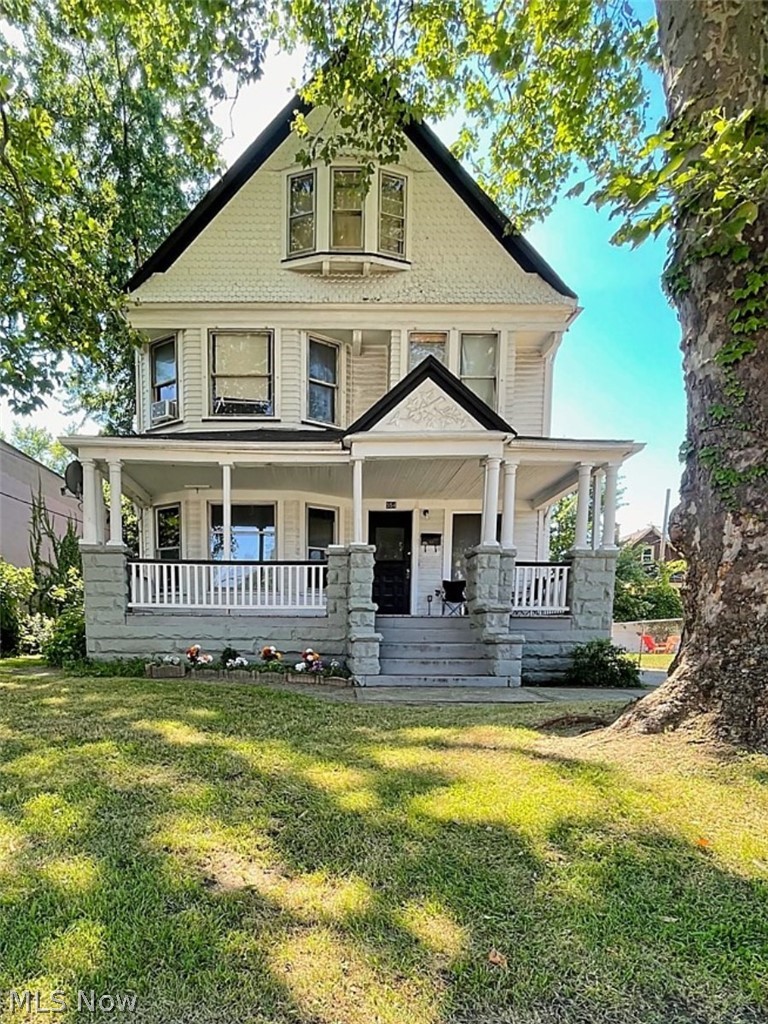554 Eddy Road Cleveland, OH 44108 - Photo 1 of 32 Victorian home with covered porch and a front lawn