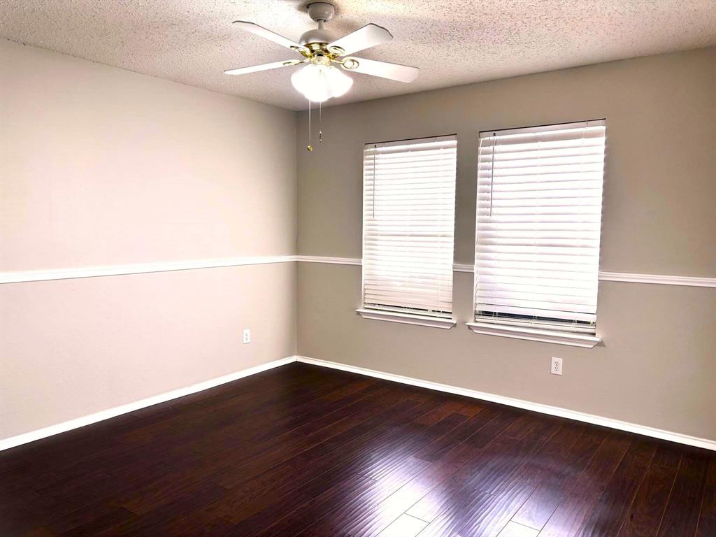 8201 Canoe Ridge Lane Denton, TX 76210 - Photo 16 of 25 wooden floor in an empty room with a window