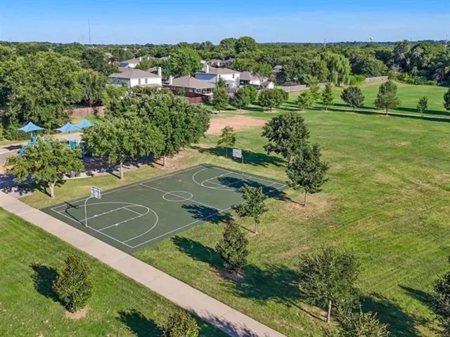 a view of a garden with a building
