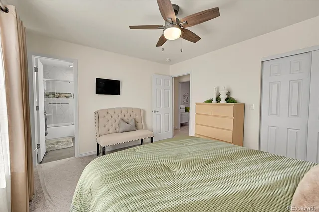 a bedroom that has a bed and a chandelier