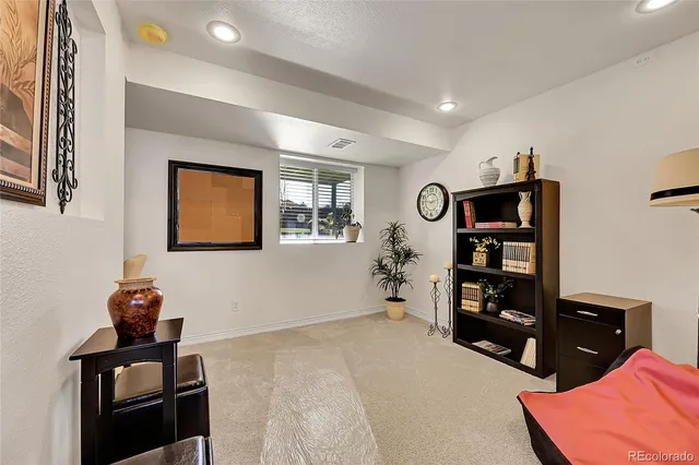 a view of workspace with furniture and closet
