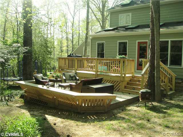 15015 Walnut Bend Road Midlothian, VA 23112 - Photo 11 of 12 a view of a house with backyard swimming pool and sitting area