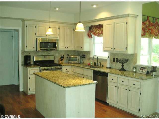 15015 Walnut Bend Road Midlothian, VA 23112 - Photo 2 of 12 a kitchen with stainless steel appliances granite countertop a sink a stove and a wooden floor