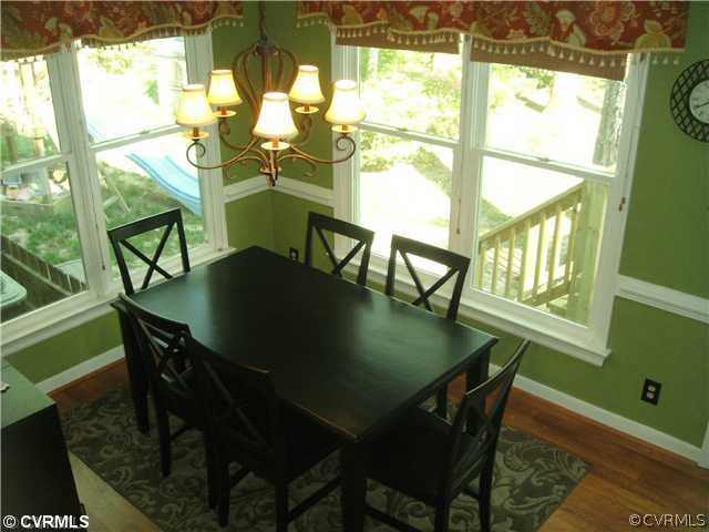 15015 Walnut Bend Road Midlothian, VA 23112 - Photo 3 of 12 a view of a dining room with furniture window and outside view