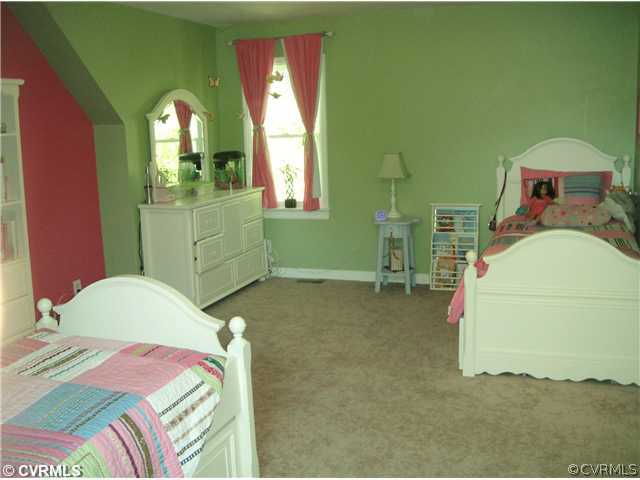 15015 Walnut Bend Road Midlothian, VA 23112 - Photo 10 of 12 a bedroom with a bed and a mirror