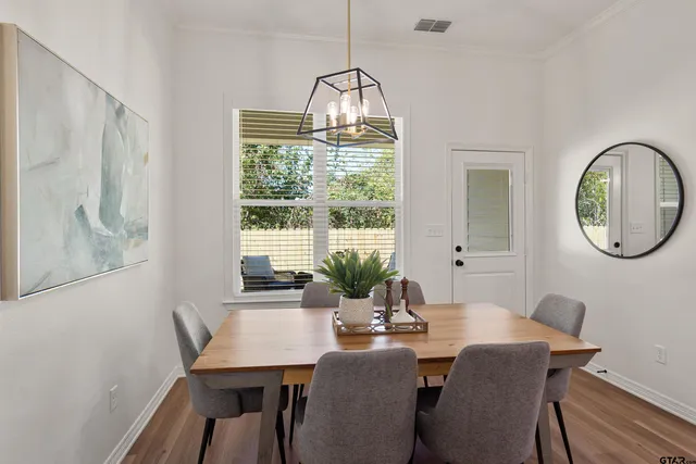 a view of a dining room with furniture window and outside view