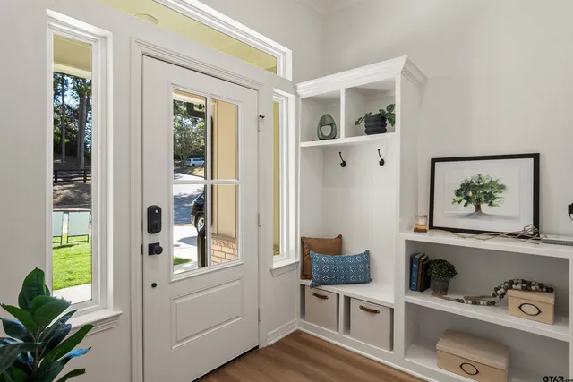 a view of an entryway with wooden floor