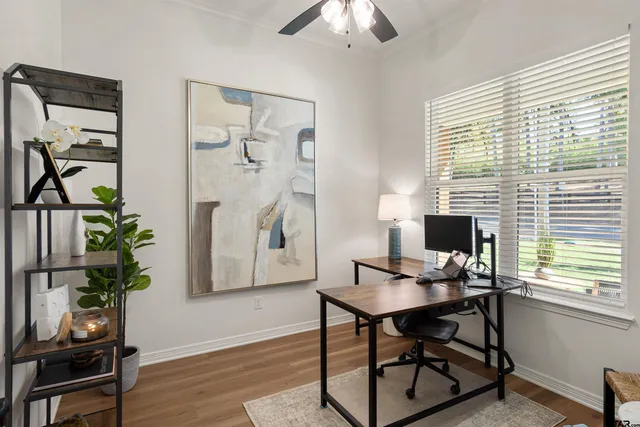 a workspace with furniture and a window