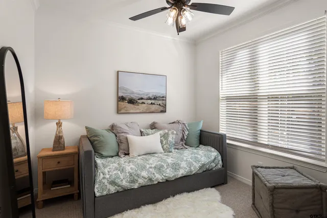a balcony with furniture and a potted plant