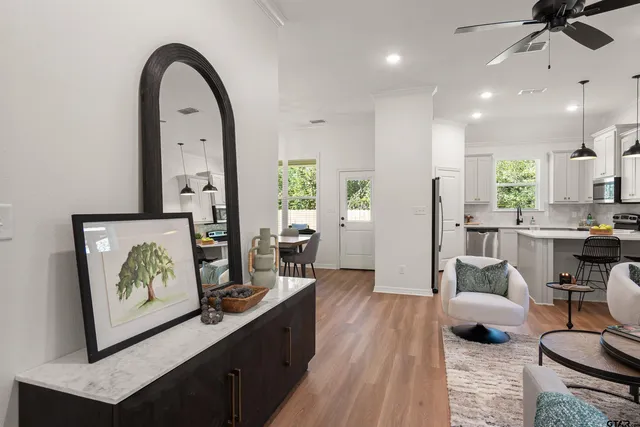 a living room with furniture and a large window