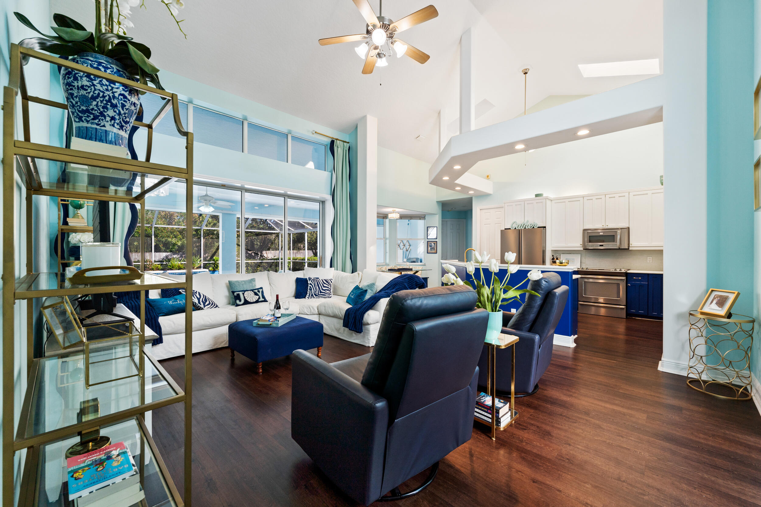 619 Fischer Hammock Road Sebastian, FL 32958 - Photo 11 of 36 a living room with lots of furniture and a chandelier