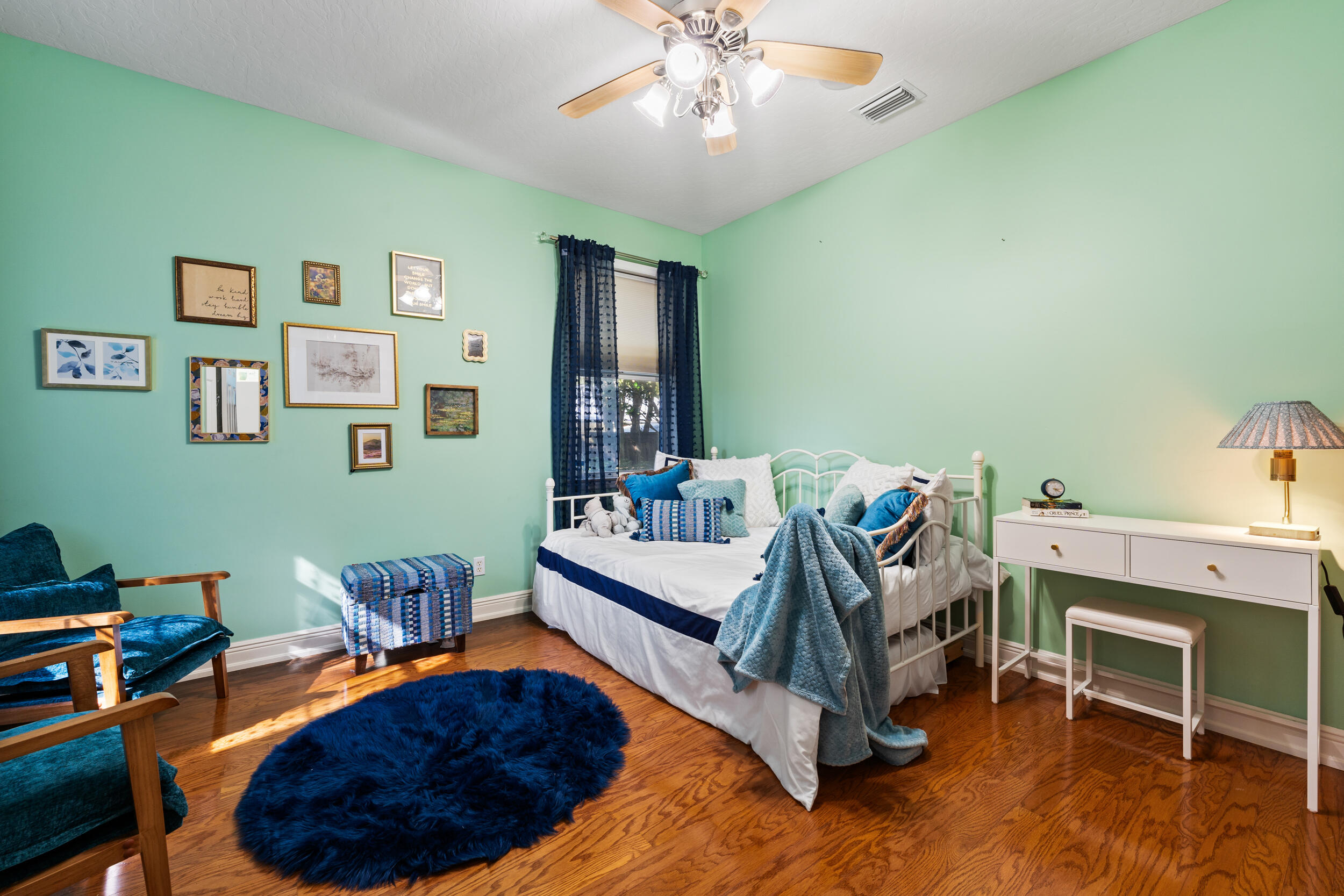 619 Fischer Hammock Road Sebastian, FL 32958 - Photo 19 of 36 a bedroom with furniture and a wooden floor