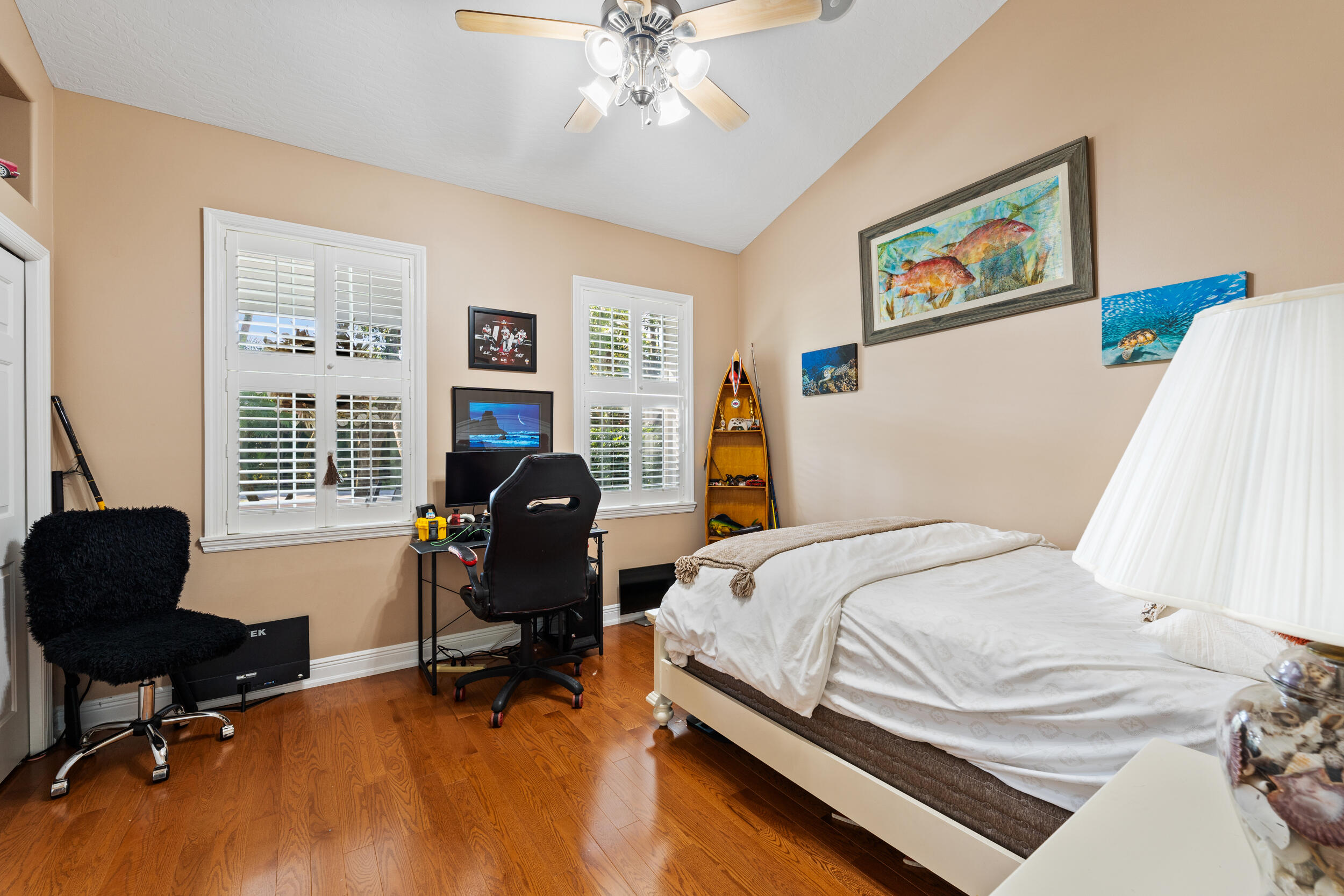 619 Fischer Hammock Road Sebastian, FL 32958 - Photo 21 of 36 a bedroom that has a bed and a chair in it
