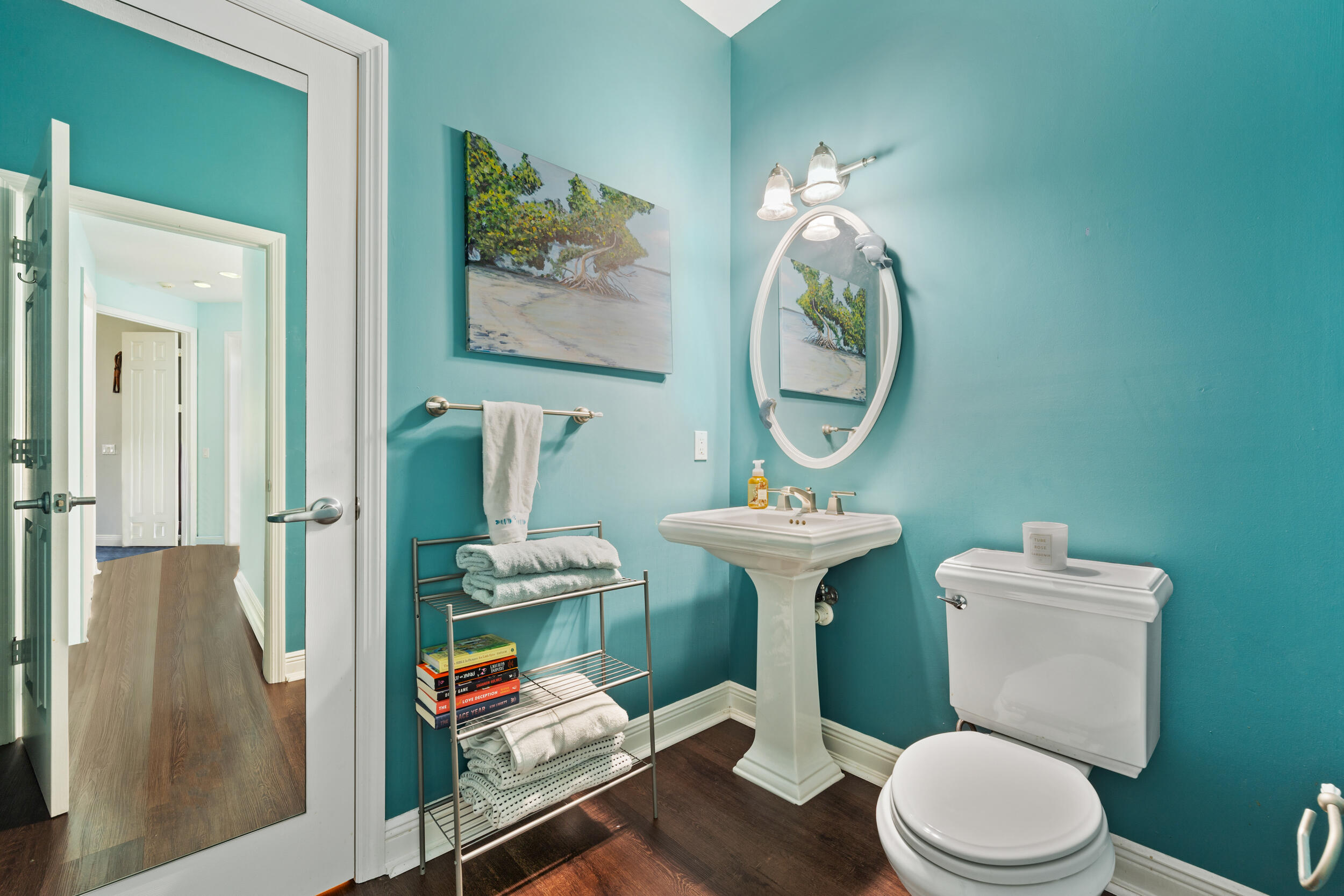 619 Fischer Hammock Road Sebastian, FL 32958 - Photo 22 of 36 a bathroom with a toilet a sink and a mirror