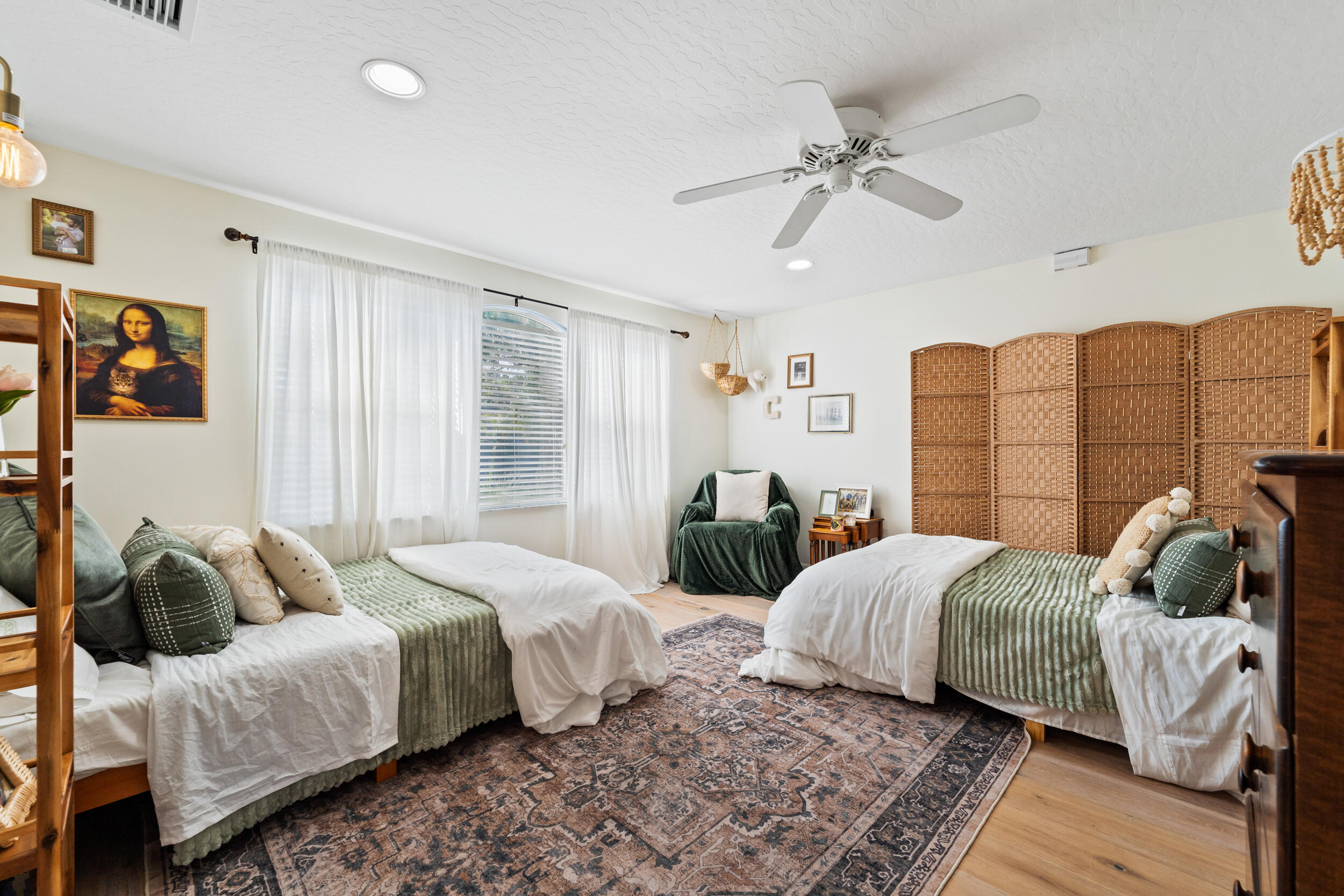 619 Fischer Hammock Road Sebastian, FL 32958 - Photo 23 of 36 a bedroom with two beds and a window