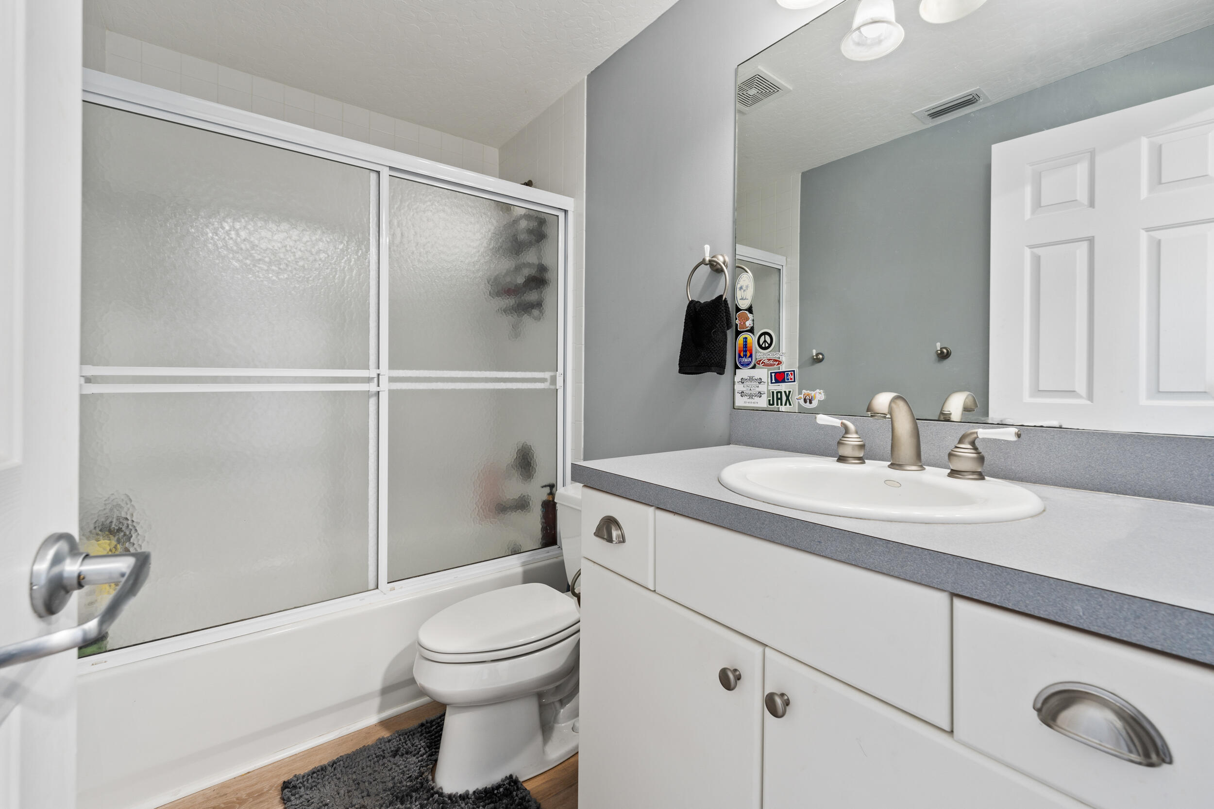 619 Fischer Hammock Road Sebastian, FL 32958 - Photo 24 of 36 a bathroom with a sink toilet vanity and shower