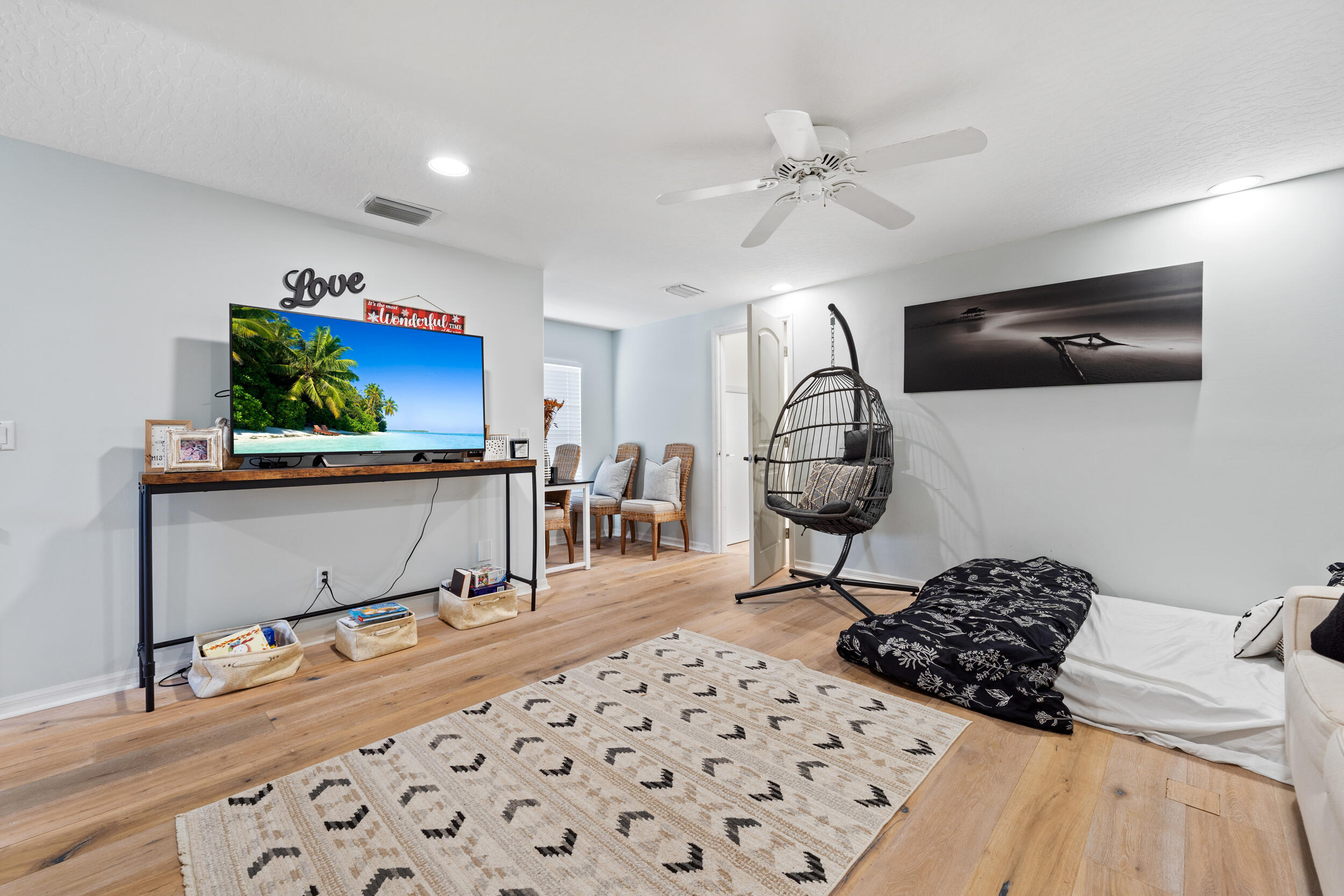 619 Fischer Hammock Road Sebastian, FL 32958 - Photo 26 of 36 a bedroom with a bed and a chandelier