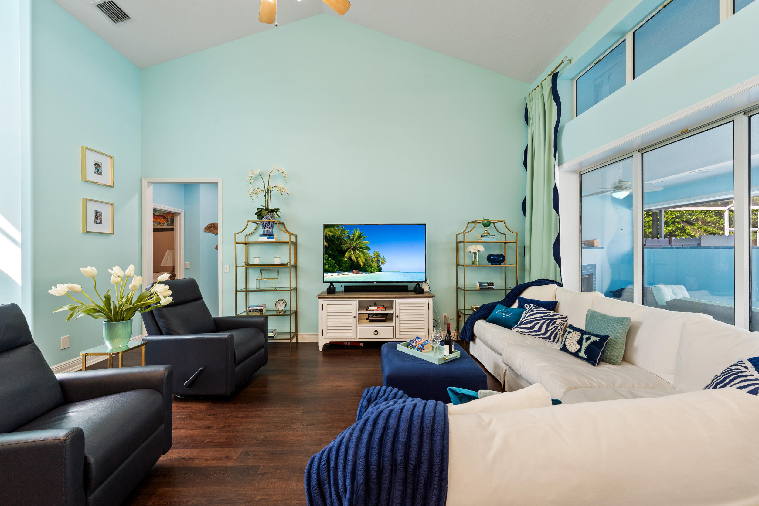 619 Fischer Hammock Road Sebastian, FL 32958 - Photo 5 of 36 a living room with furniture and a flat screen tv