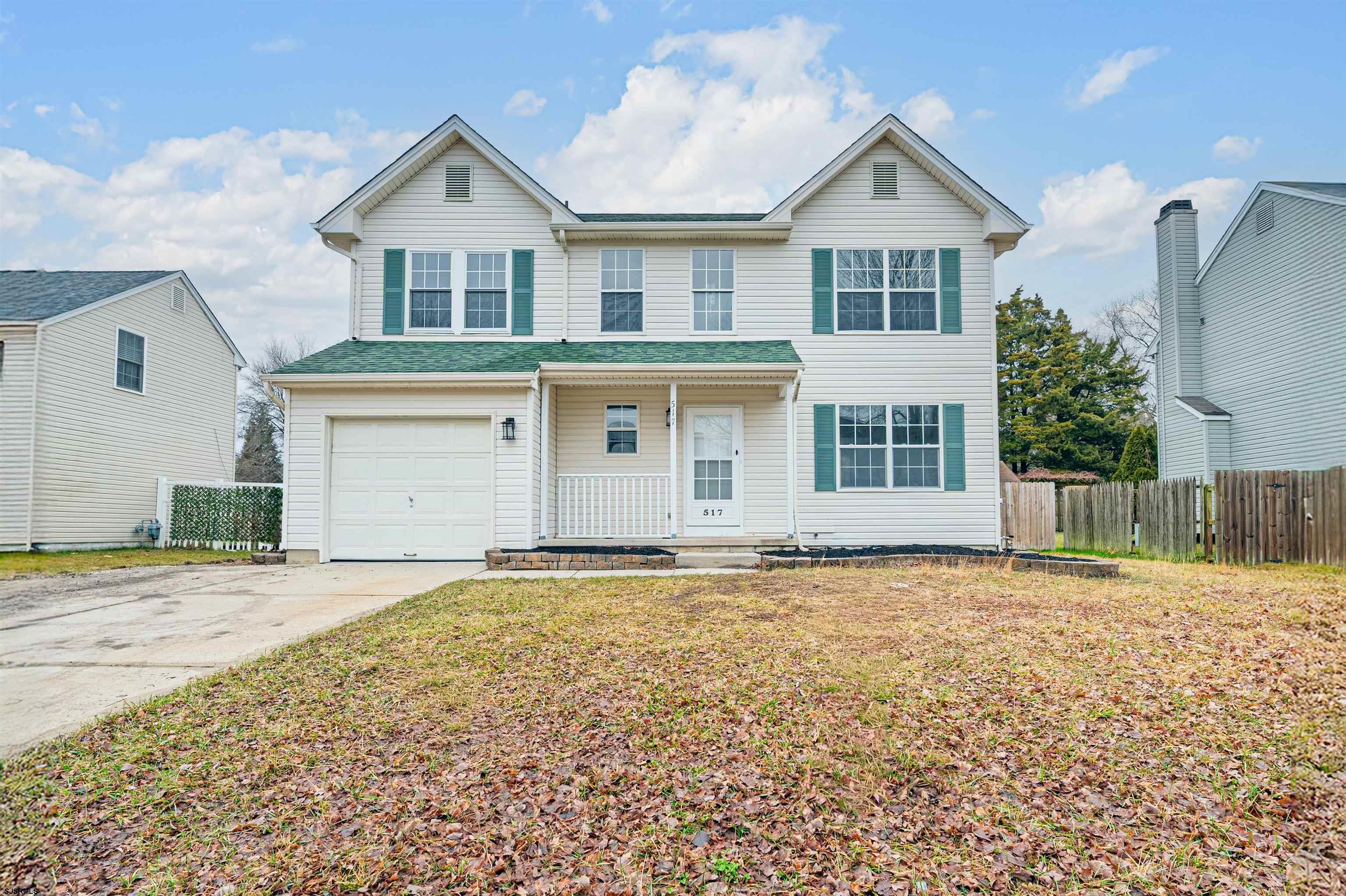 517 Superior Road Egg Harbor Township, NJ 08234 - Photo 1 of 35 a front view of a house with a yard and garage