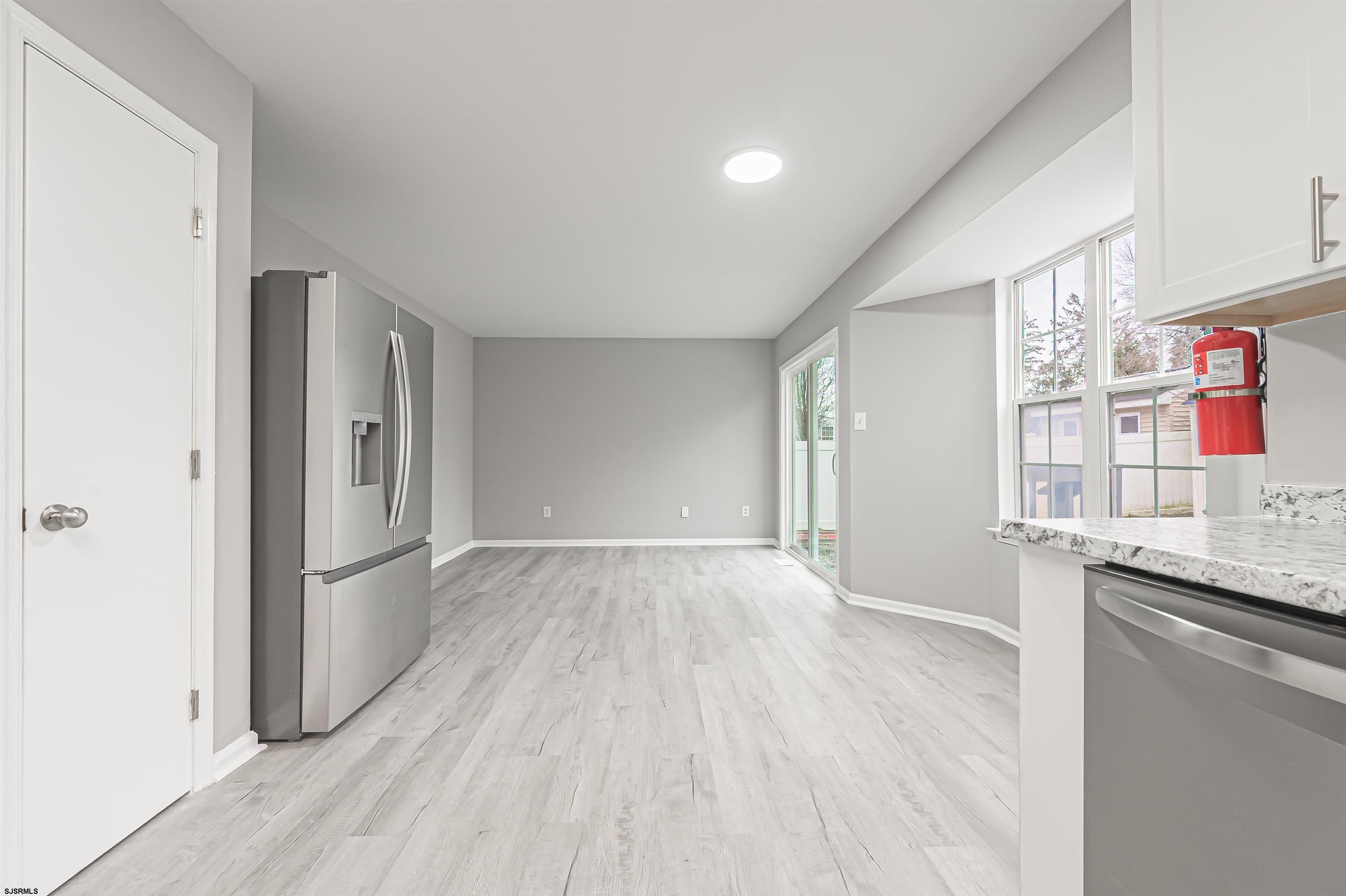 517 Superior Road Egg Harbor Township, NJ 08234 - Photo 18 of 35 a view of hallway with cabinets and wooden floor