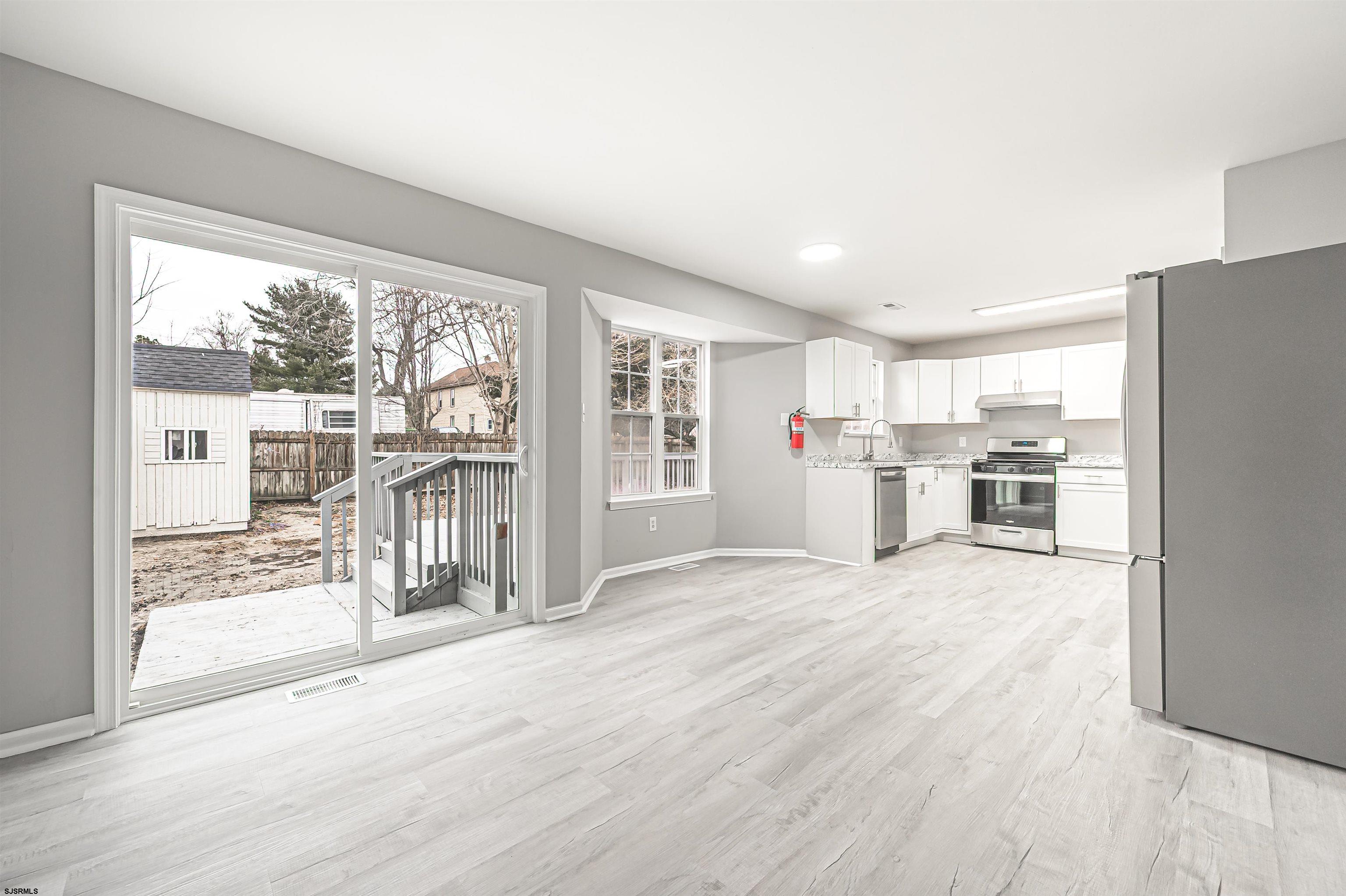 517 Superior Road Egg Harbor Township, NJ 08234 - Photo 20 of 35 a view of empty room with wooden floor and floor to ceiling window