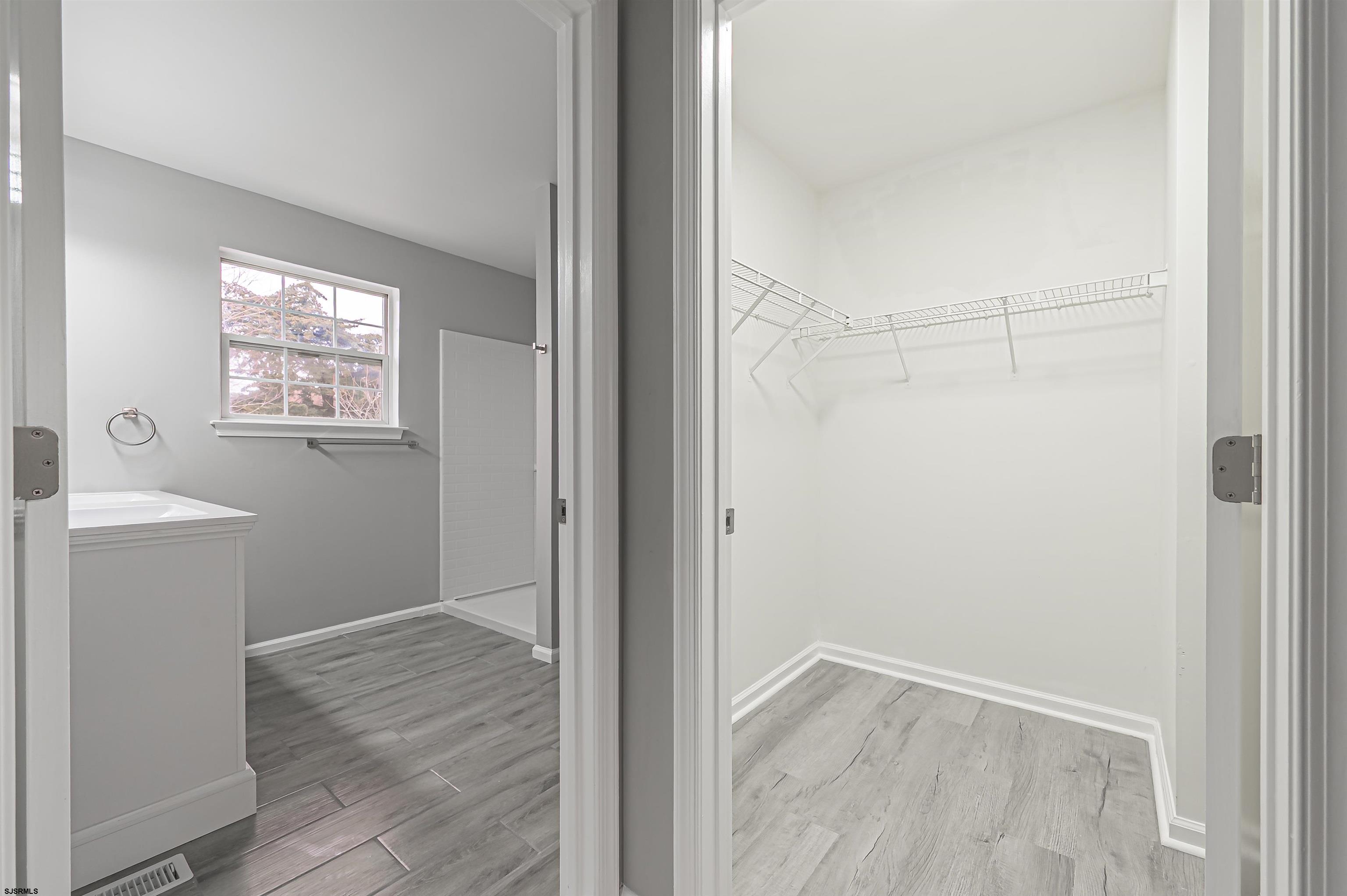 517 Superior Road Egg Harbor Township, NJ 08234 - Photo 27 of 35 a view of an empty room with wooden floor and a window