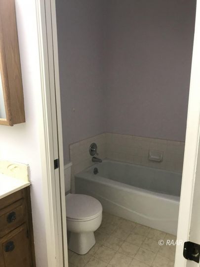 1219 North Erwin Street Ridgecrest, CA 93555 - Photo 15 of 20 a bathroom with a toilet and shower