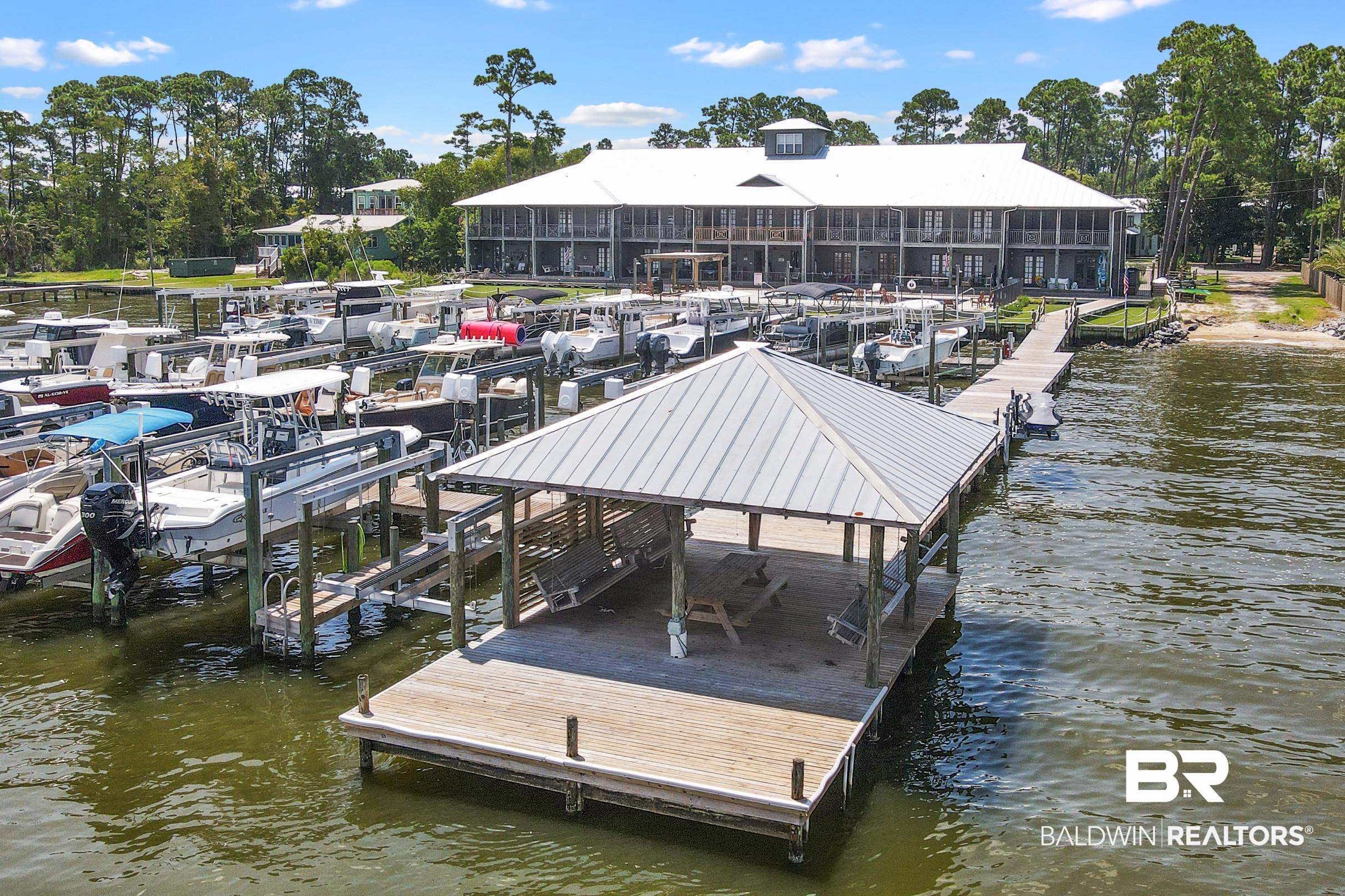 25773 Canal Road, Unit 18 Orange Beach, AL 36561 - Photo 36 of 44 Dock featuring a water view and boat lift