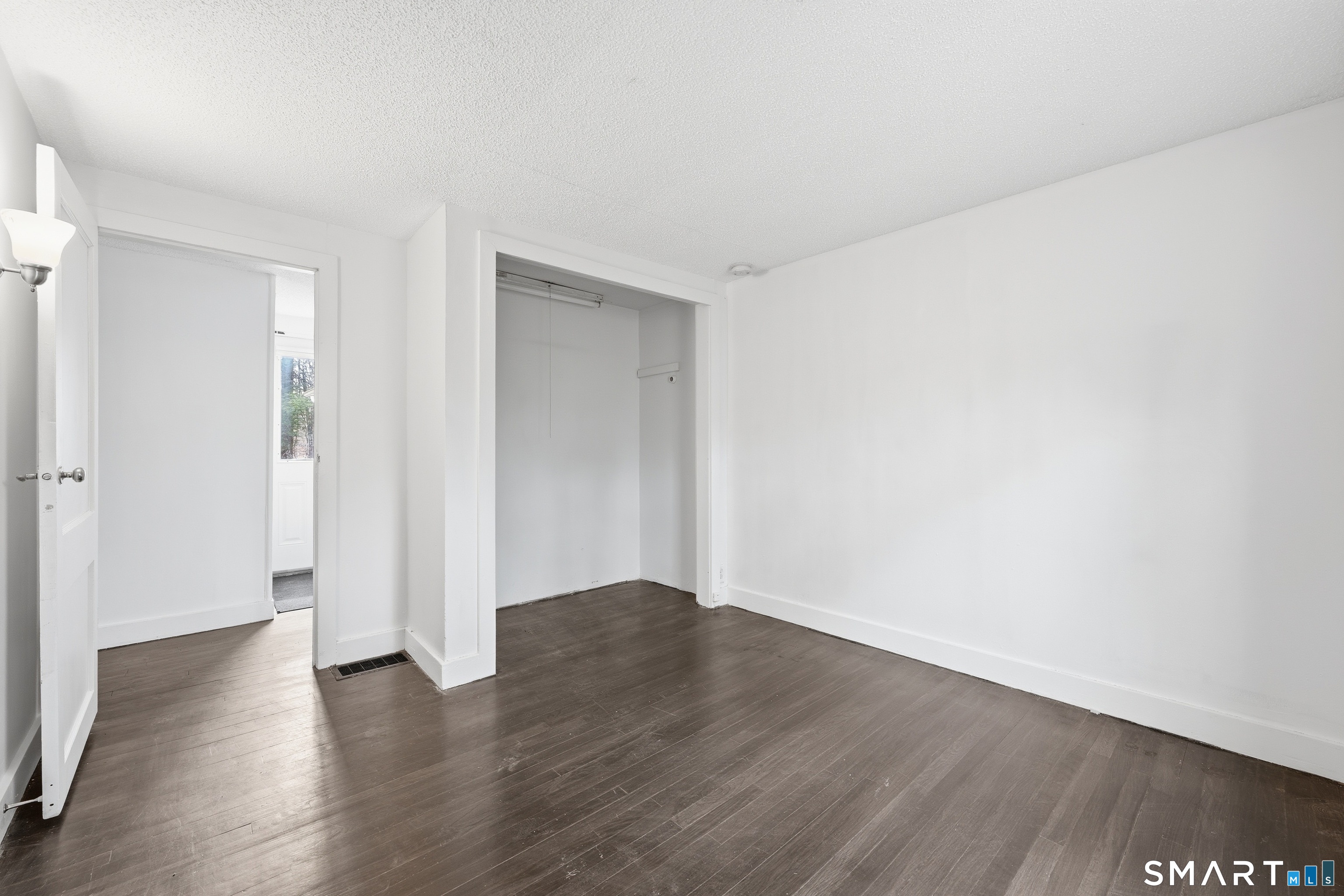 660 Opening Hill Road Madison, CT 06443 - Photo 11 of 36 a view of an empty room with wooden floor