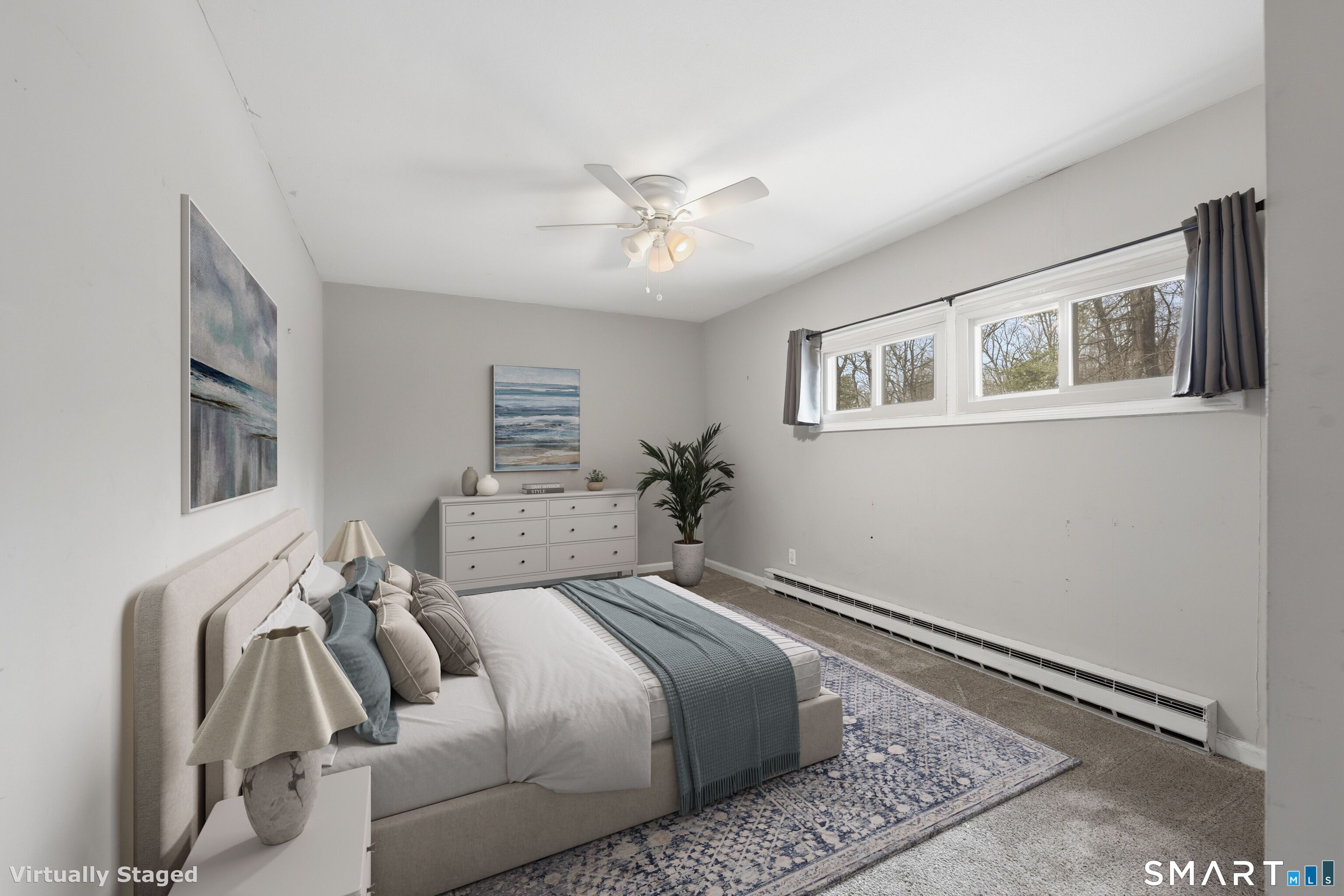 660 Opening Hill Road Madison, CT 06443 - Photo 26 of 36 a bedroom with a bed and a chandelier